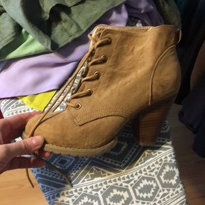 Tan two 1/2 in heel booties. Low heel ankle boot